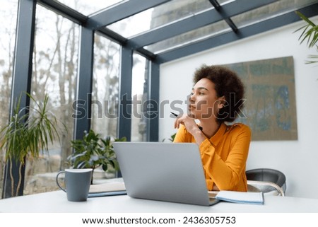 Similar – Image, Stock Photo Focused stylish black woman applying eyeliner at home