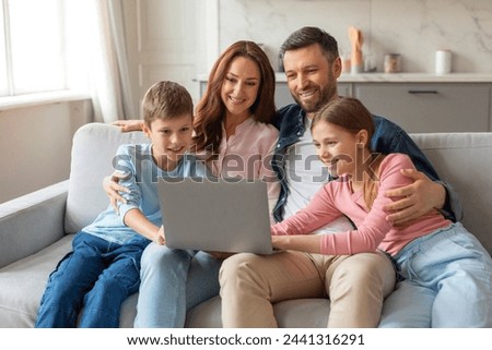 Similar – Image, Stock Photo Happy young family sitting on sofa at home