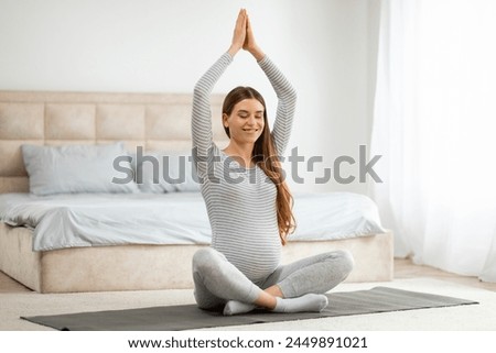 Similar – Image, Stock Photo Pregnant woman on yoga ball working out with elastic band