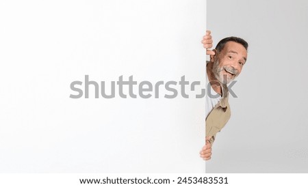 Similar – Image, Stock Photo Senior man in protective mask staying home during pandemic lockdown.