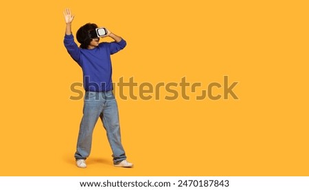 Similar – Image, Stock Photo Black man exploring virtual reality on seashore