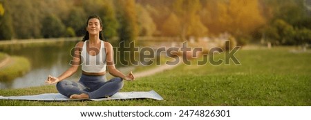 Similar – Image, Stock Photo Smiling woman in lotus pose in gym