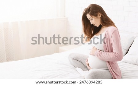 Image, Stock Photo young pregnant woman at home working on laptop. cute beagle dog besides