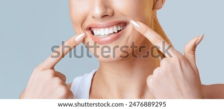 Similar – Image, Stock Photo Young beautiful smiling woman wearing silk scarf around her neck and leather jacket looking away standing at plain background