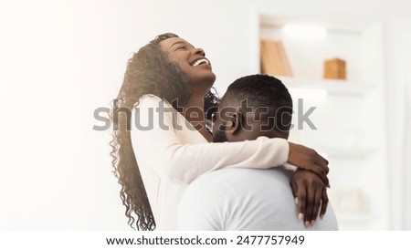 Image, Stock Photo Romantic black couple embracing on street