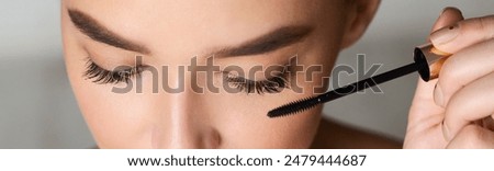 Similar – Image, Stock Photo Crop woman doing makeup in studio