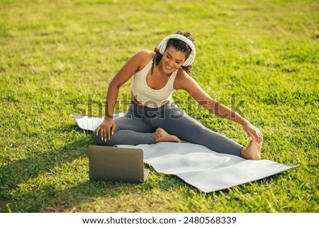 Similar – Image, Stock Photo Happy woman stretching legs during yoga class with trainer