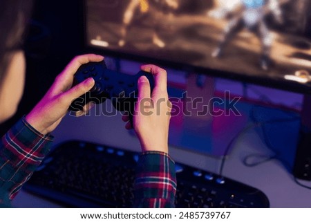 Similar – Image, Stock Photo Gamer playing video game at home