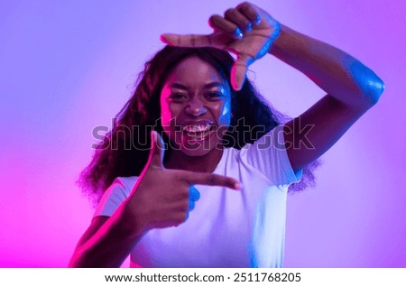 Similar – Image, Stock Photo Cheerful black showing frame gesture on city street