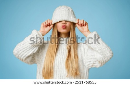 Similar – Image, Stock Photo Junge Frau mit Mütze hockt nachts angeleuchtet in orangem Laternenlicht auf einem Zebrastreifen in der Stadt