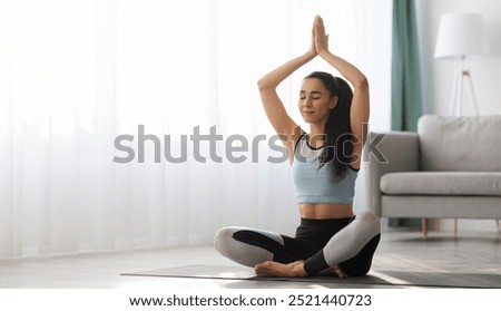 Similar – Image, Stock Photo Cheerful athletes practicing yoga together in mountain pose in contemporary workout room