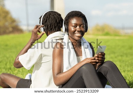 Similar – Image, Stock Photo Black friends sitting back to back in city