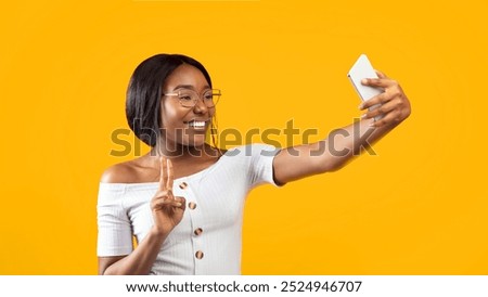 Similar – Image, Stock Photo Stylish black woman making a phone call on smartphone on the street