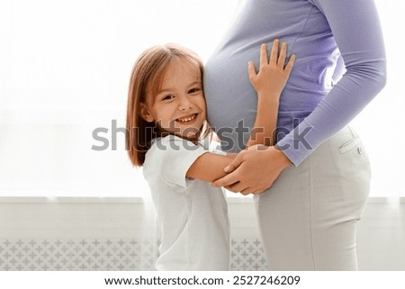 Similar – Image, Stock Photo Mom and her little daughter are walking, holding hands, spending time together
