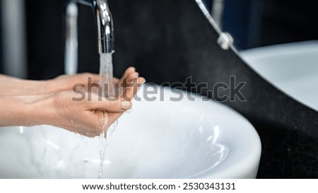 Similar – Image, Stock Photo unrecognizable woman washing hands on a sink with soap. Coronavirus covid-19 concept