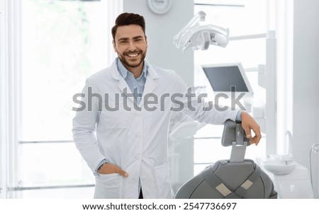 Image, Stock Photo Young bearded male dentist drilling tooth to female patient