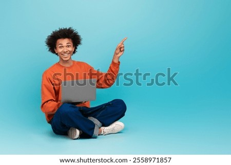 Similar – Image, Stock Photo Smiling curly haired man listening to music in headphones