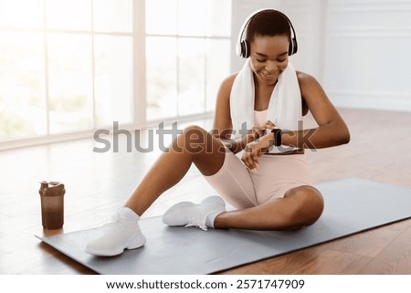 Similar – Image, Stock Photo Happy African American sportswoman with bottle of water