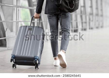 Similar – Image, Stock Photo Unrecognizable man walking on roadside on crossing