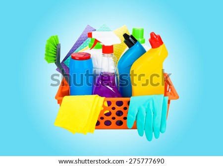 Cleaning supplies in a basket - cleaning and housekeeping concept