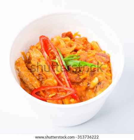 Mexican cuisine food delivery - chili con carne in white plastic plate closeup isolated at white background in plastic plate