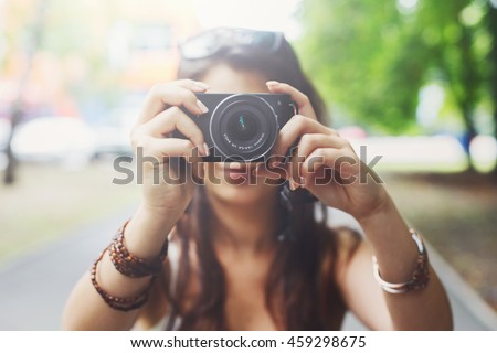 Similar – Image, Stock Photo Unrecognizable photographer taking photo on camera near wall outdoors