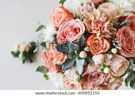 Photo of Wedding flowers, bridal bouquet closeup. Decoration made of roses, peonies and decorative plants, close-up, selective focus, nobody, objects
