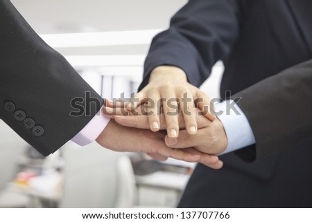 Pile of Three Business People Hands Together