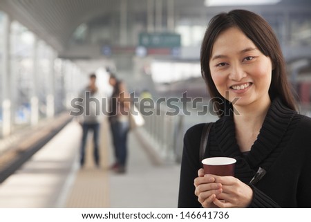 Young Woman on Train Platform