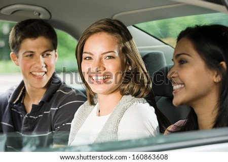 Three friends in the back of car