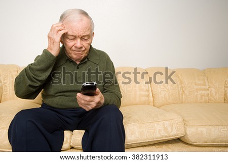 stock-photo-confused-elderly-man-with-remote-control-382311913.jpg