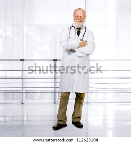 Portrait of confident senior medical doctor on clinic background