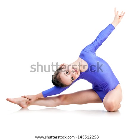 cute young girl doing gymnastics isolated over white