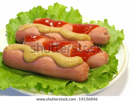 Sausages with ketchup and mustard on a white plate