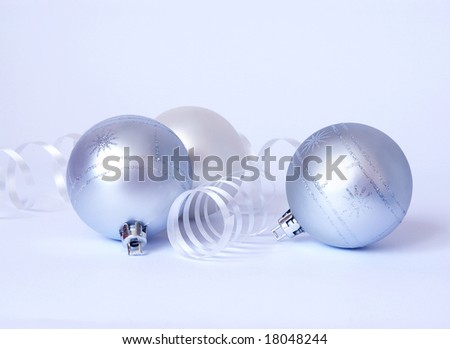 Christmas card. Three white spheres and streamer