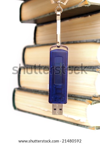 Books stack and flash memory isolated on white