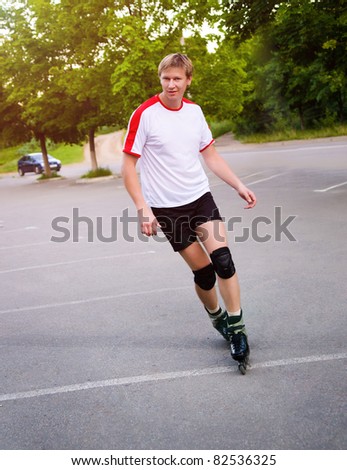 Young active roller blade skater on the park