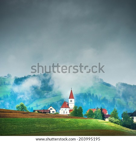 Church on the hill in the Alps. France