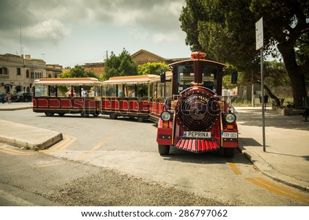 MEDINA, MALTA - MAY 26: Excursion train in the historical part of the city. Medina, Malta on May, 26  2015. Medina - this is the first capital of Malta