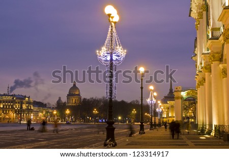 St. Petersburg, Russia, cathedral of St. Isaak (Isaakiyevskiy) and entrance to Hermitage art museum (Winter palace) at night with Christmas illumination.