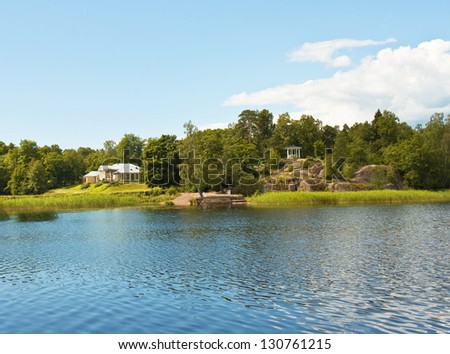 Summer landscape  with house recorded in park Monrepo near town Vyborg in Russia on bank of Gulf of Finland.