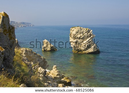 Sea landscape with two rocks in water, recorded in place Tarhankut in region Crimea on Black sea.