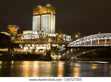 Moscow, building of Academy of Science and Andreevskiy bridge on Moscow-river at night.
