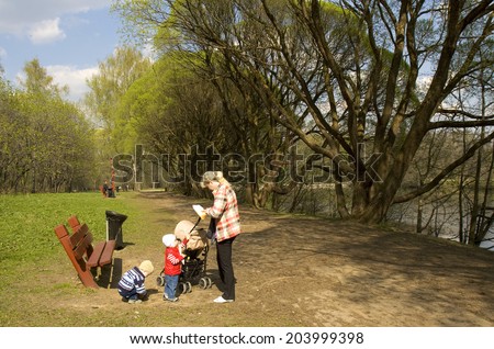 MOSCOW - APRIL 29, 2014: people rest in Izmaylovskiy park in summer. The biggest park of Europe with territory 1500 hectare exist on basis of former king estate from 16 century