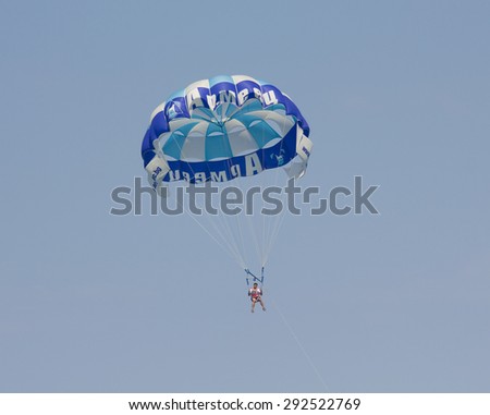 SAINT CONSTANTINE AND SAINT HELEN, BULGARIA - JULY 01, 2014: parachutist in the sky - summer sports offered for tourists on sea shore.