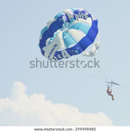 SAINTS CONSTANTINE AND HELEN, BULGARIA - JULY 01, 2014: parachutist in the sky. The oldest resort of Bulgaria, exist from 1908 year, provides wide range of extreme and water sports.
