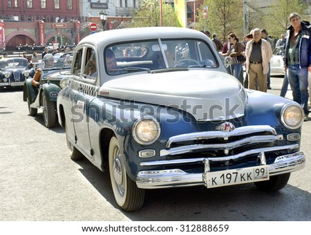 MOSCOW - APRIL 27, 2014: Russian retro car Pobeda (Victory) of 1956 year on rally of classical cars, organized by Russian Club of Classical Autocars on Theatre square.