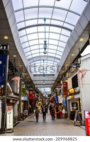 MATSUYAMA,JAPAN - 10 , April,2014 :In Matsuyama shopping arcade , most shops here open into the night and the shopping street remains lively with strolling visitors and ryokan guests in their yukata.