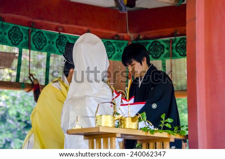 KAMAKURA, JAPAN - 24 April, 2014: In Tsurugaoka Hachimangu, a wedding ceremonies are performed at the Maiden (Lower Worship Hall) or at Wakamiya shrine