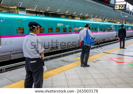 TOKYO,JAPAN - 30 April 2014 :JR East\'s rail service company is known as TESSEI, and it is responsible for the cleaning of the bullet trains when they have come to a stop at Tokyo Station.